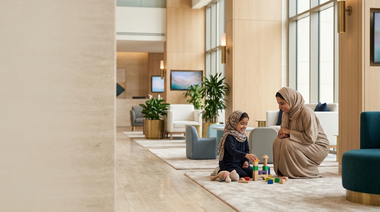 Cheerful young child playing beside a caring parent in a bright modern family clinic